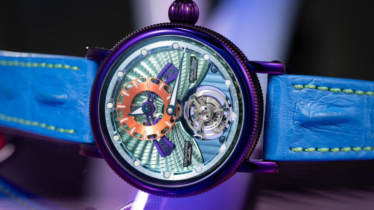 Chronoswiss Open Gear Flying Tourbillon Psycho with purple case, green guilloché dial, orange hour ring and blue strap