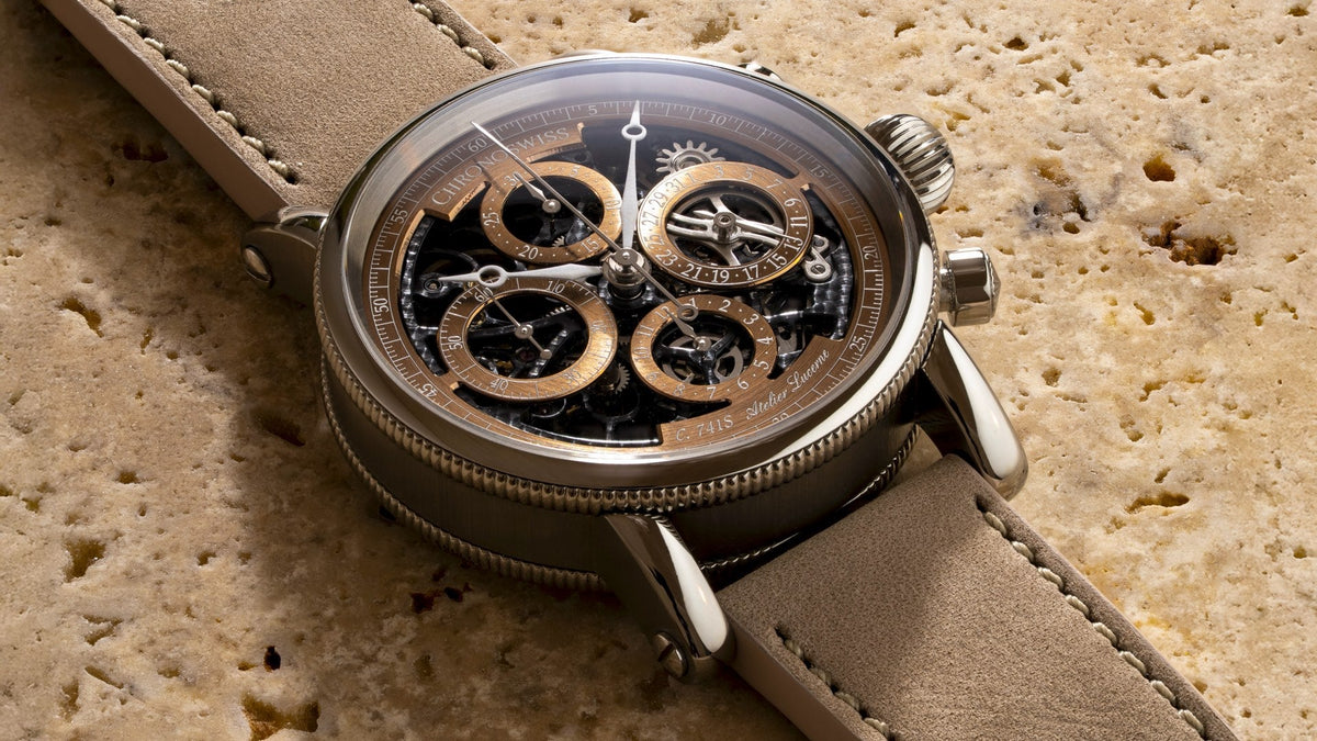 Chronoswiss Opus Dakar resting on travertine stone, skeletonised brown dial with C.741S Atelier Lucerne engraving