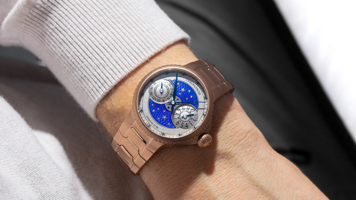 Chronoswiss PULSE GMT Enamel Sky Gold with blue enamel dial of gold stars and integrated red gold bracelet, front view