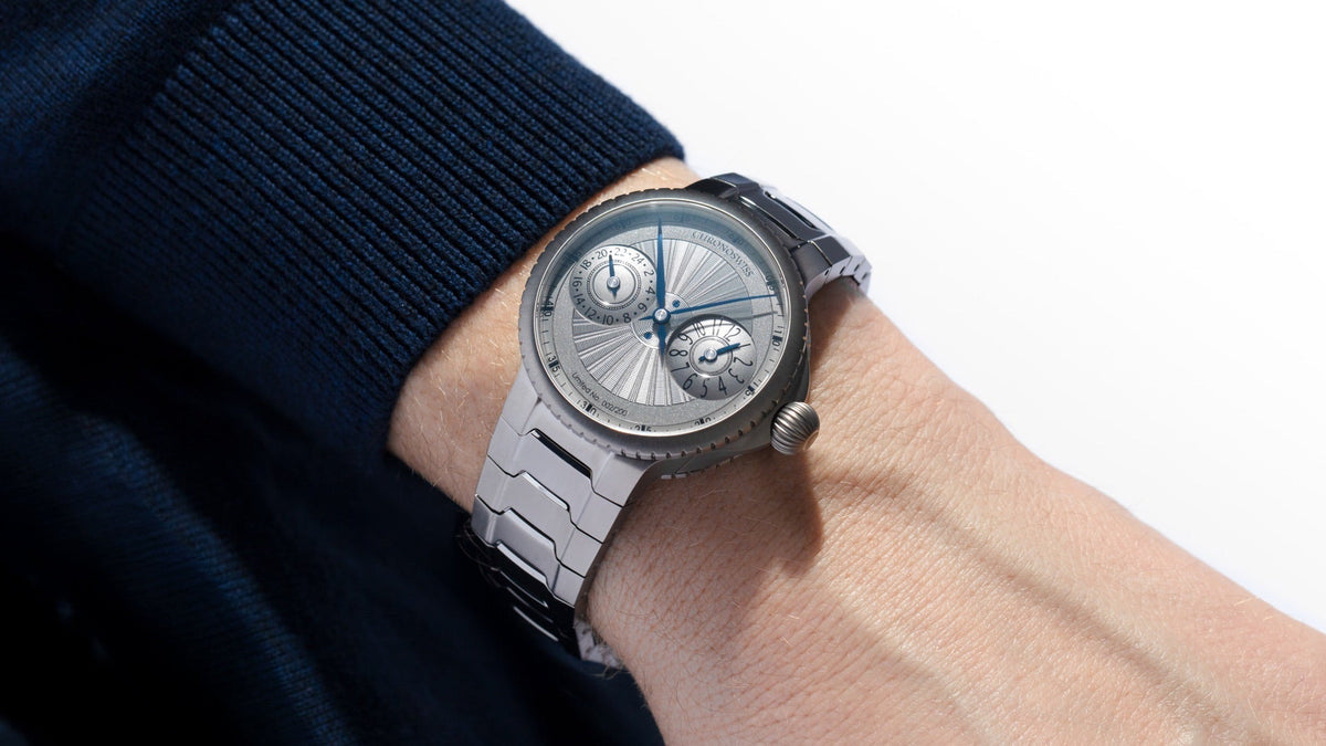 Chronoswiss PULSE GMT Silver Guilloche with silver guilloché dial and integrated titanium bracelet, front view
