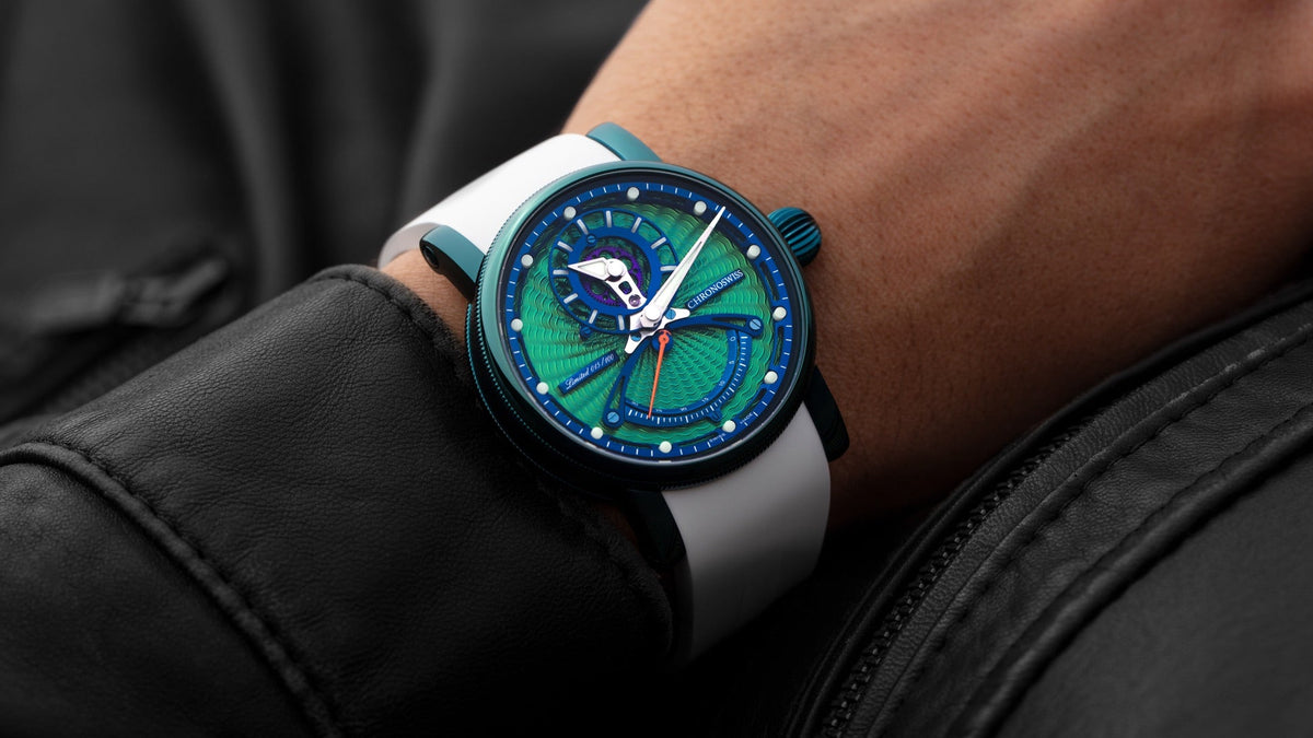 Chronoswiss ReSec Snake Manufacture worn on the wrist under a black leather jacket sleeve, green dial and white rubber strap