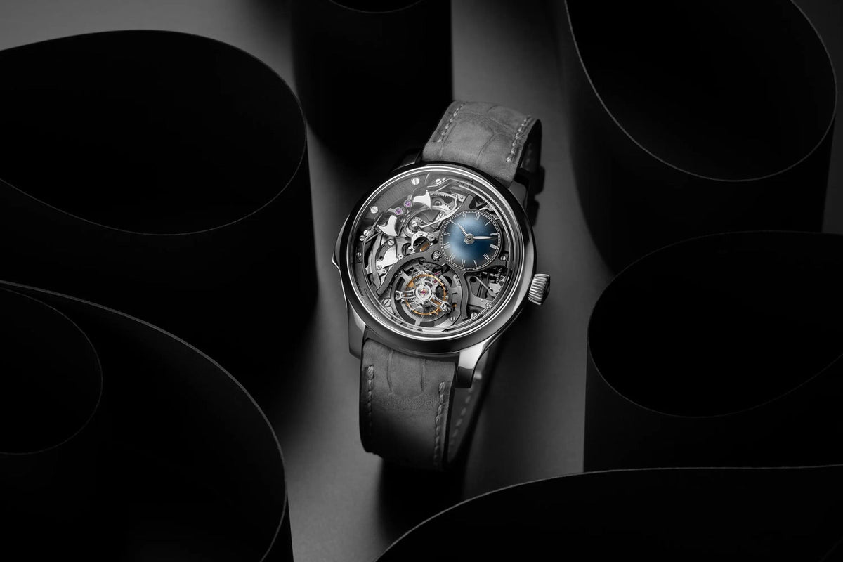 H. Moser & Cie. Endeavour Minute Repeater Cylindrical Tourbillon Skeleton on a dark sculptural backdrop, full skeletonised dial and blue sub-dial