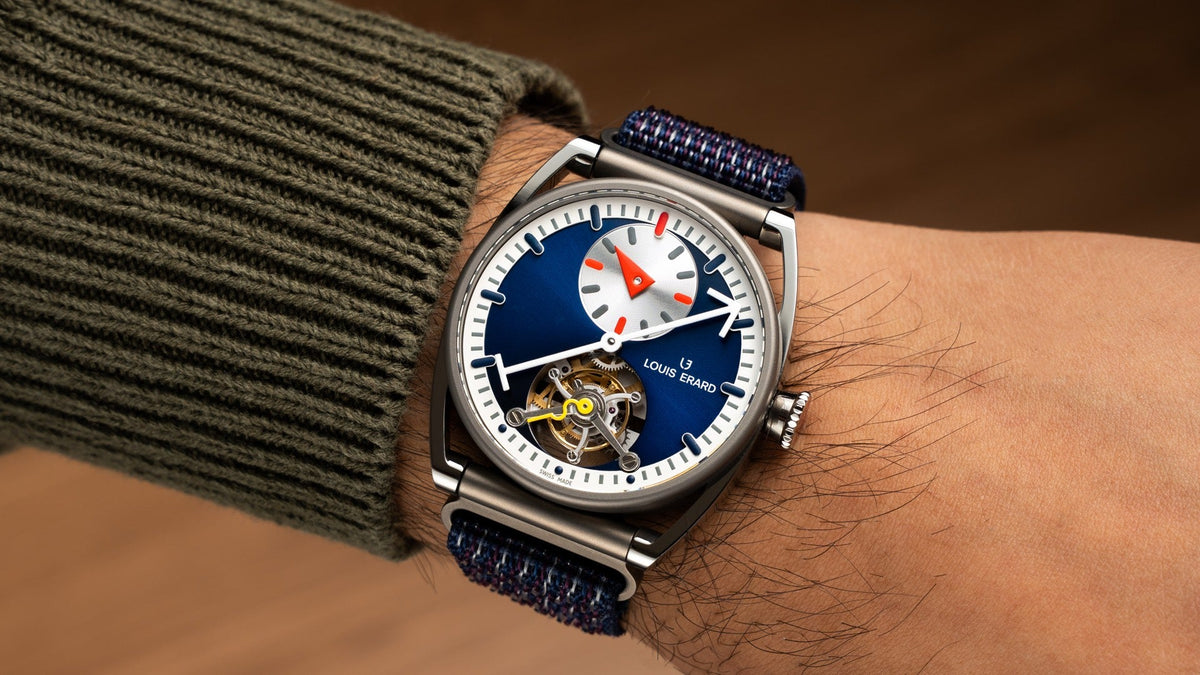 Louis Erard x Alain Silberstein Tourbillon Régulateur Blue worn on the wrist under a green knit sleeve