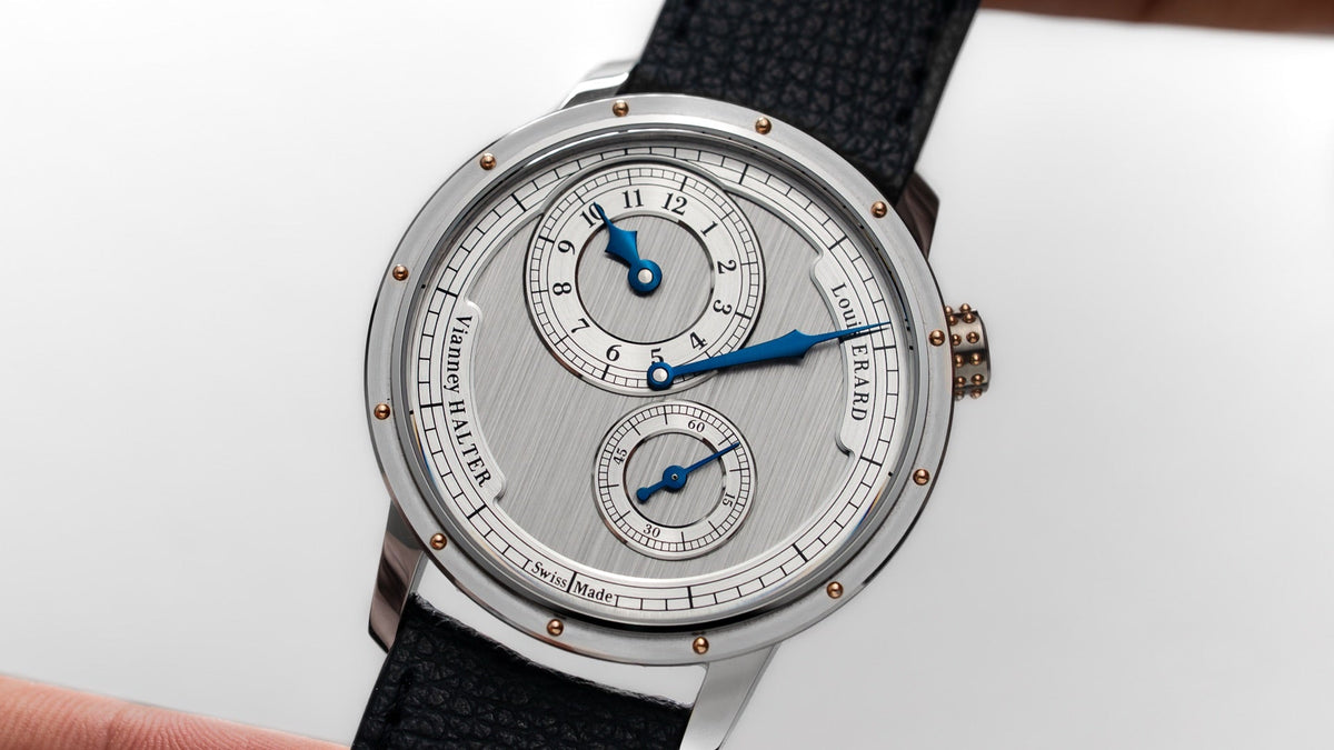 Louis Erard x Vianney Halter Le Régulateur II held in the hand, silver dial in close view