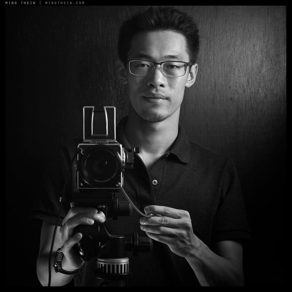 Ming Thein, founder of MING, with a medium-format camera