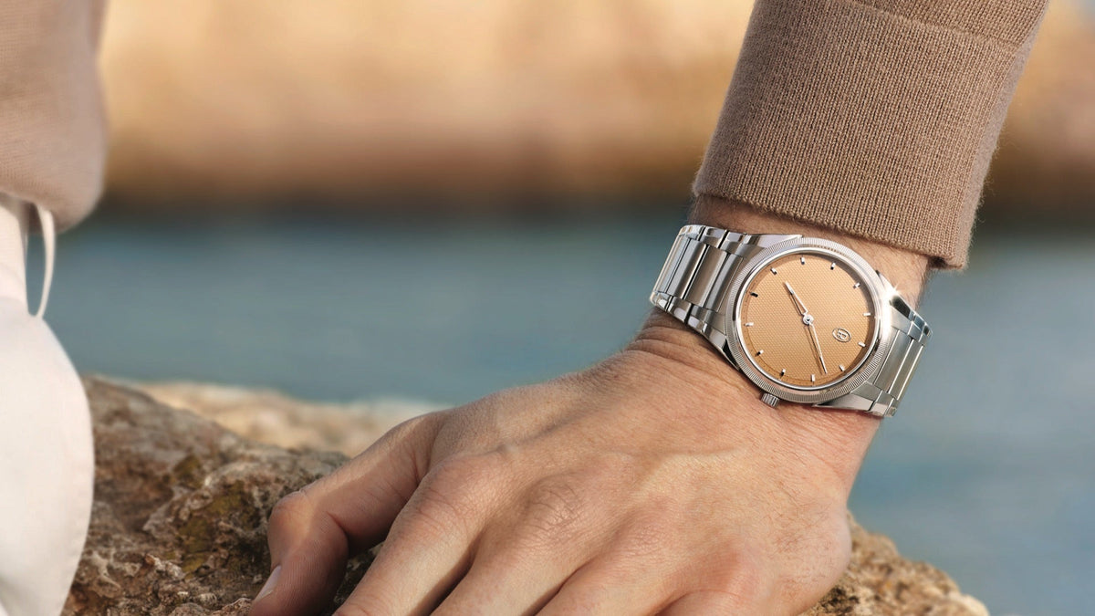 Parmigiani Fleurier Tonda PF Micro-Rotor No Date worn on the wrist on a coastal rock