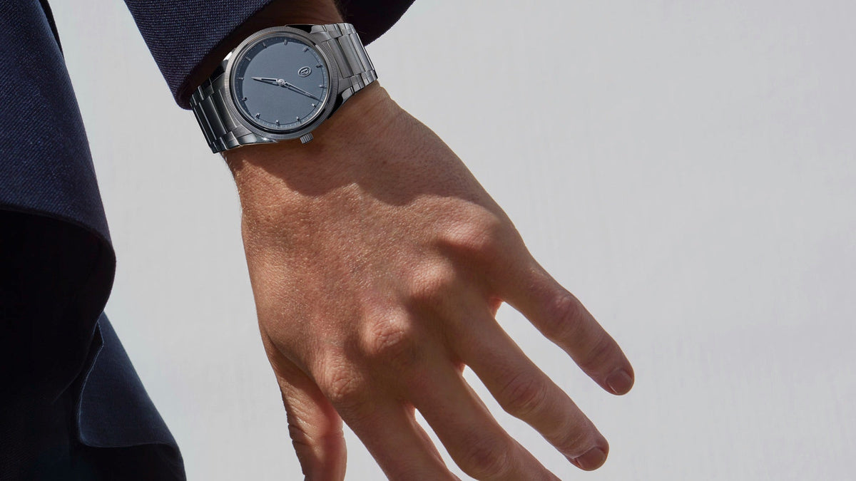 Parmigiani Fleurier Tonda PF Micro-Rotor Platinum Stone Blue worn on the wrist, hand relaxed at the side