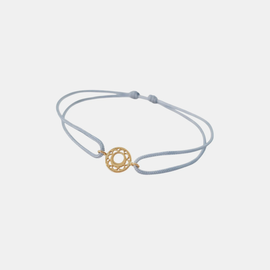 Tiny Om Communication disc bracelet on thread