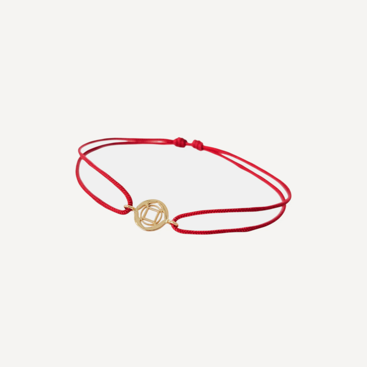 Tiny Om Roots disc bracelet on thread