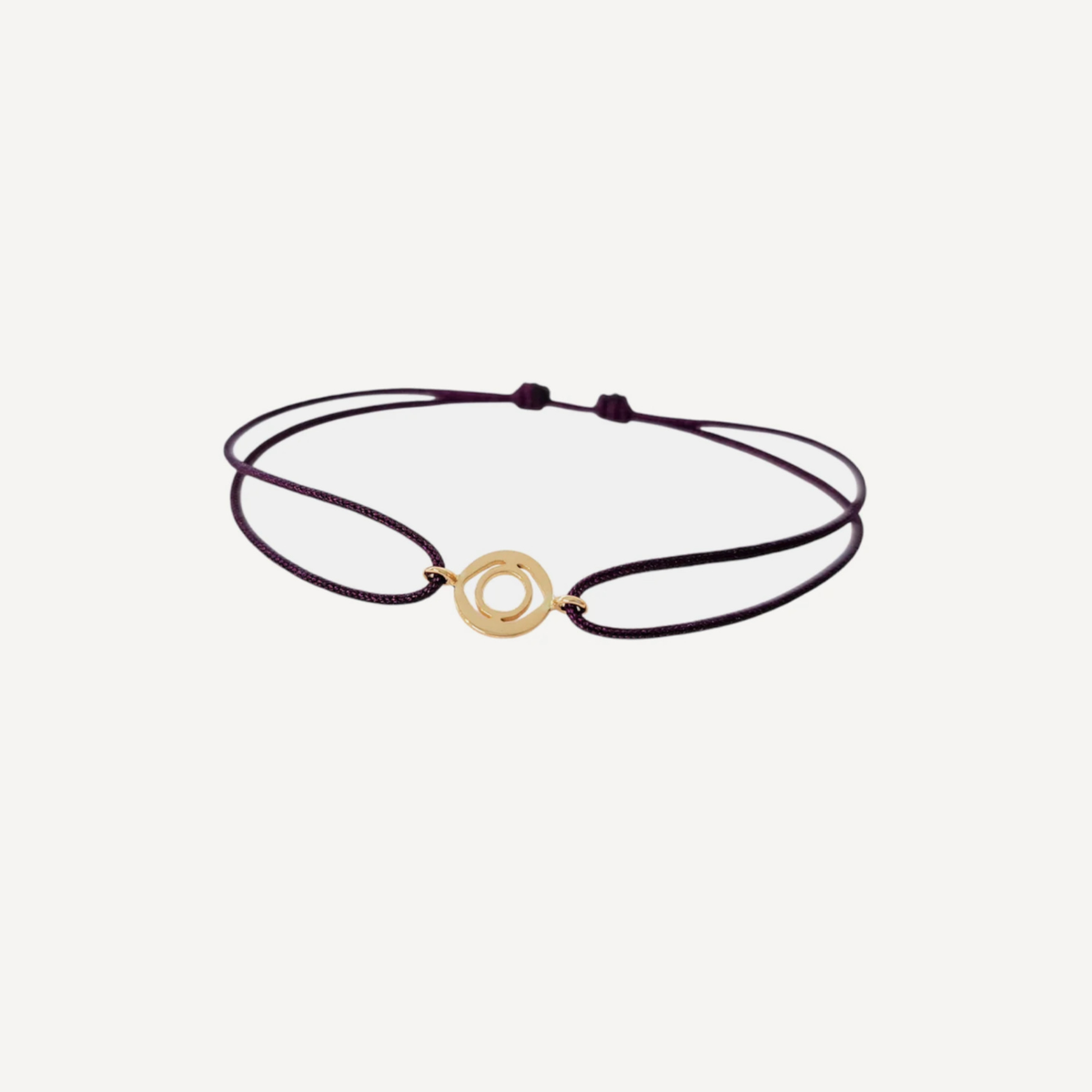 Tiny Om Serenity disc bracelet on thread