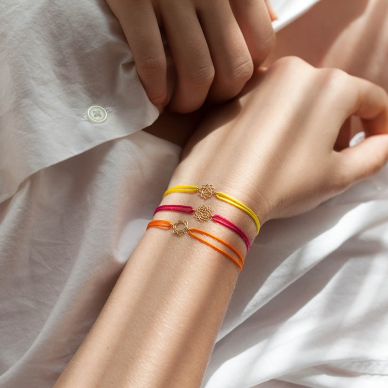 Tiny Om Chakra bracelet on thread Creativity/Svadisthana